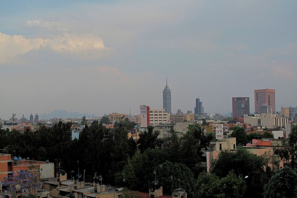 The skyline of Mexico City seen across the rooftops